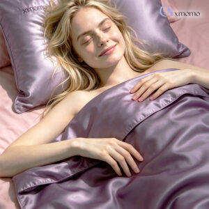 The model is lying on a lavender silk pillowcase